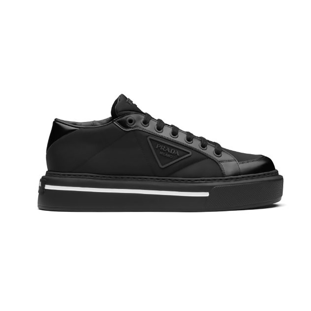 Side view of Prada Women Macro Re-Nylon and Brushed Leather Sneakers-Black
