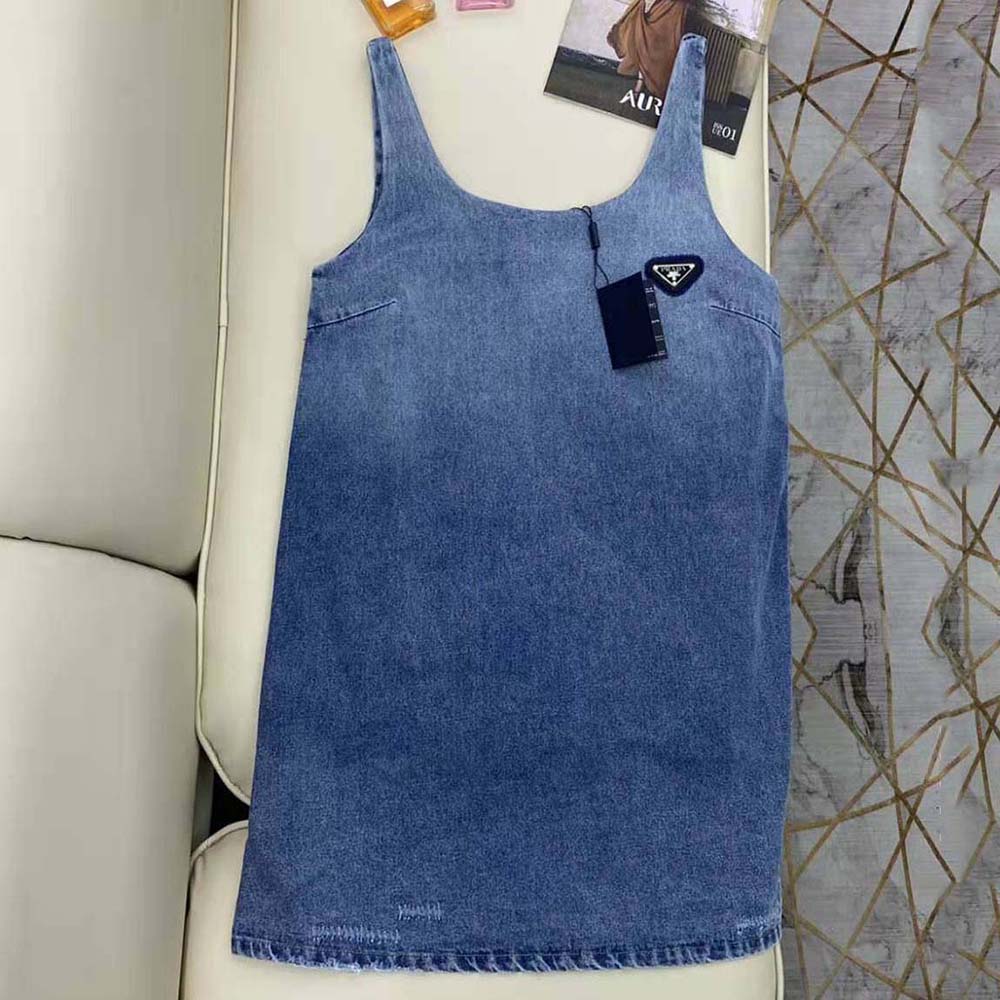 Close-up of signature Prada hardware on denim mini-dress collar