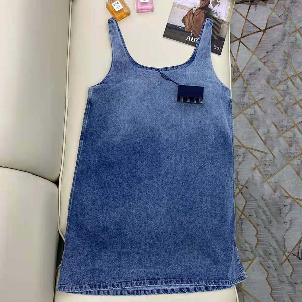 Side profile showing silhouette of Prada Women Organic Denim Mini-Dress-Navy