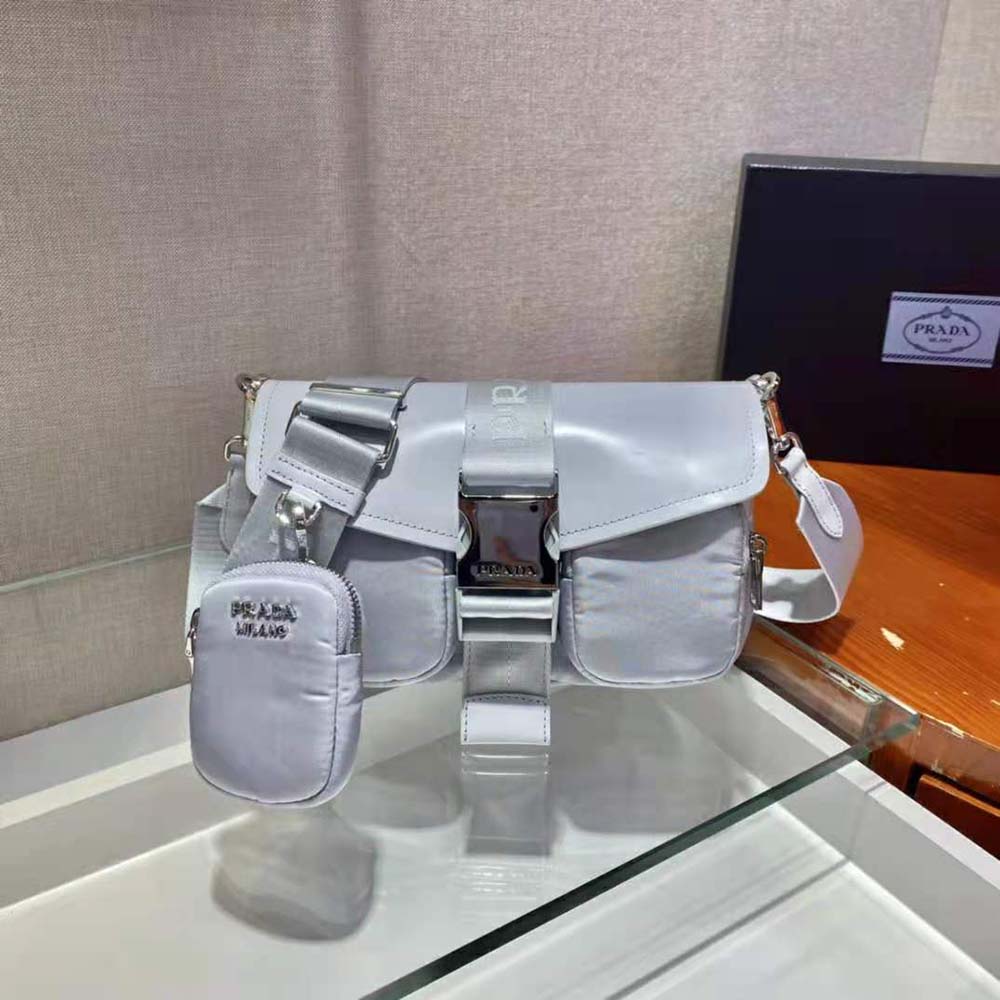 Close-up of silver-tone logo hardware on Prada Women Pocket Nylon and Brushed Leather Bag-Blue