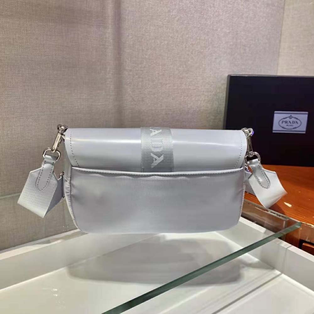Side angle showing nylon and leather contrast on Prada Women Pocket Nylon and Brushed Leather Bag-Blue