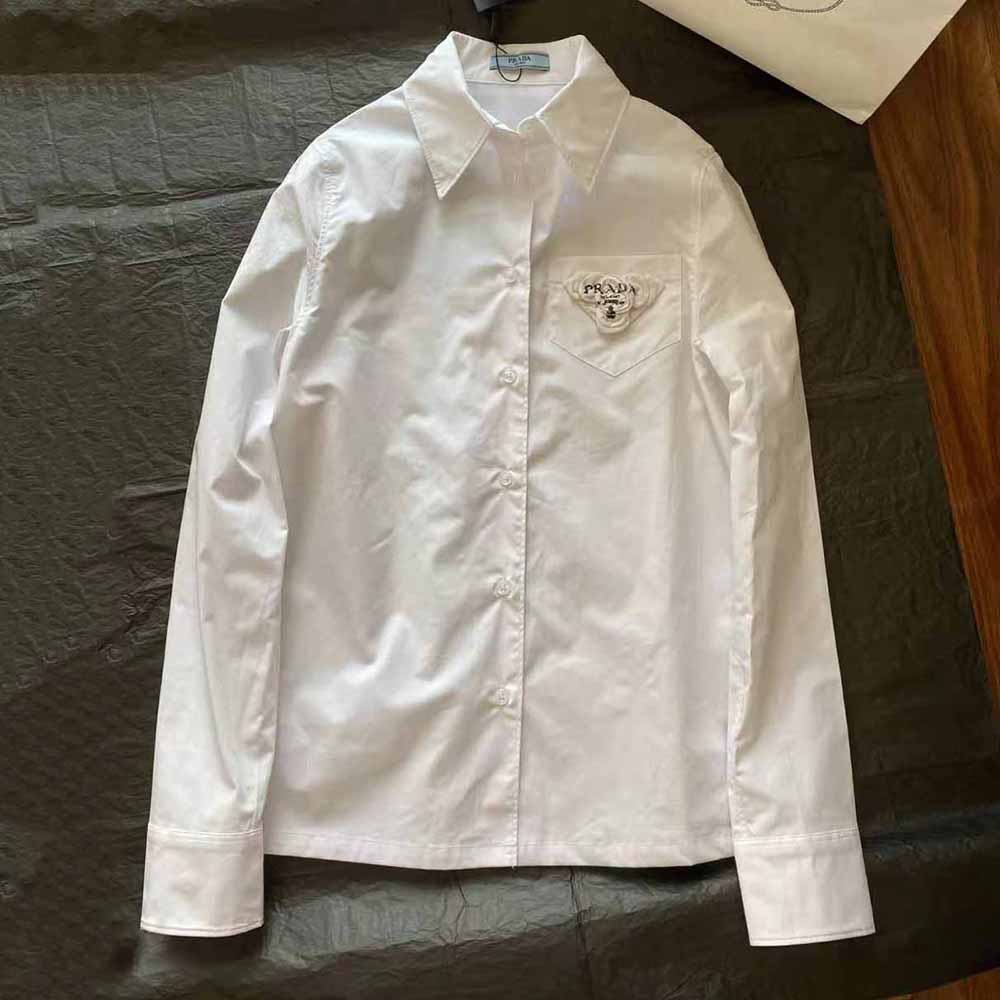 Close-up of button and collar detail on Prada Women Poplin Shirt Reveals a Complex Simplicity Constantly