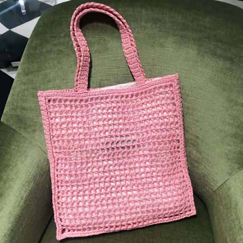 Side angle showing spacious interior of Prada Women Raffia Tote Bag-Pink