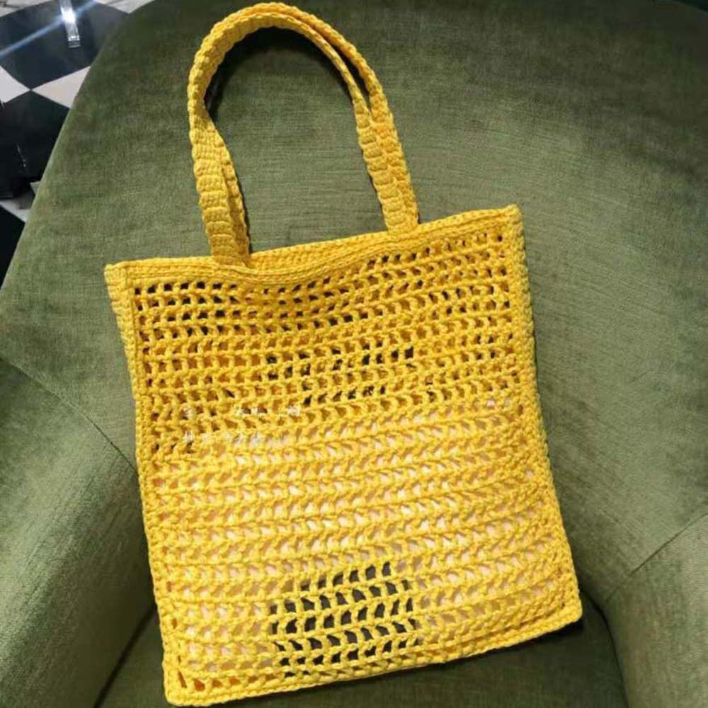 Side angle of Prada Women Raffia Tote Bag-Yellow highlighting silhouette