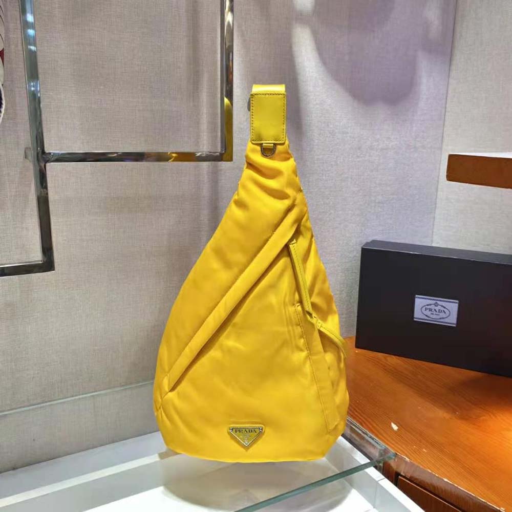 Close-up of silver Prada logo and zipper on Re-Nylon and Leather Backpack-Yellow