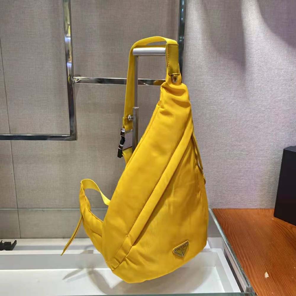 Side angle detail of adjustable straps on Prada Women Re-Nylon and Leather Backpack-Yellow