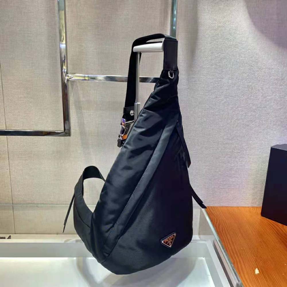 Side angle showing adjustable straps on Prada Women Re-Nylon and Leather Backpack