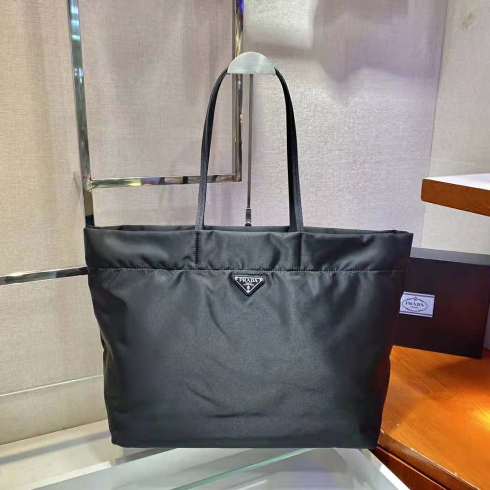 Close-up of Prada logo plaque on Re-Nylon and Saffiano Leather Tote Bag