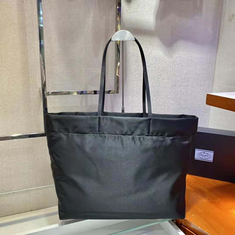 Side view showing handles and zip closure of Prada Women Re-Nylon Tote Bag