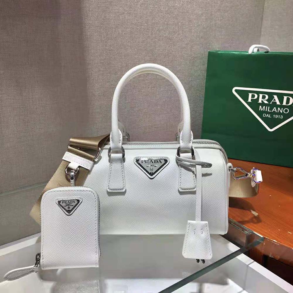 Close-up detail of white saffiano leather texture on Prada bag