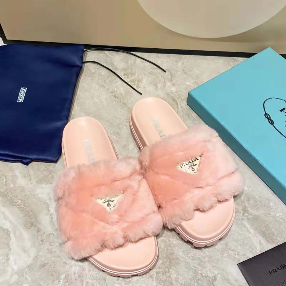 Close-up of plush shearling and embossed logo on Prada Women Shearling Slides
