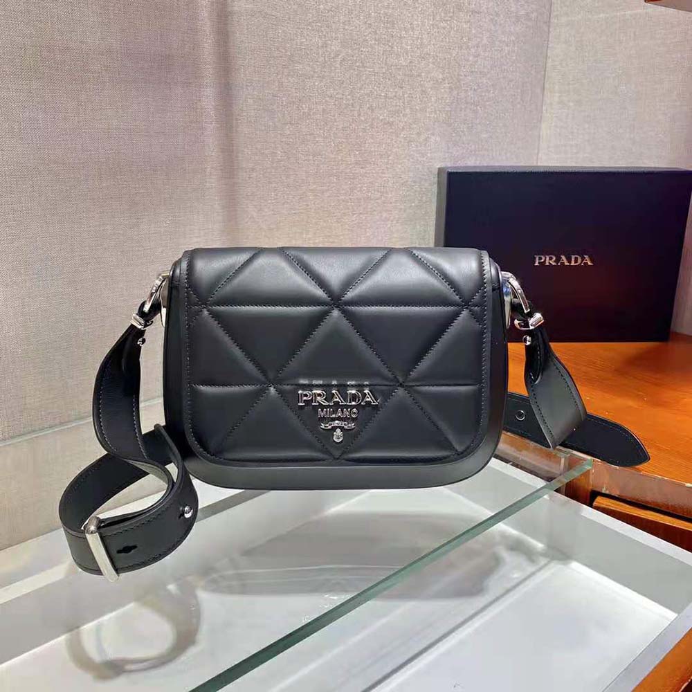 Close-up of silver-tone hardware on Prada Women Spectrum Leather Bag-Black