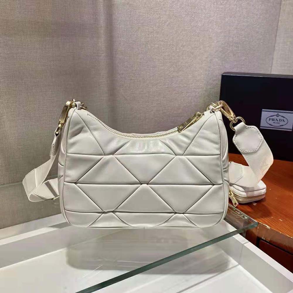 Side view showing silver hardware and strap of Prada Women System bag
