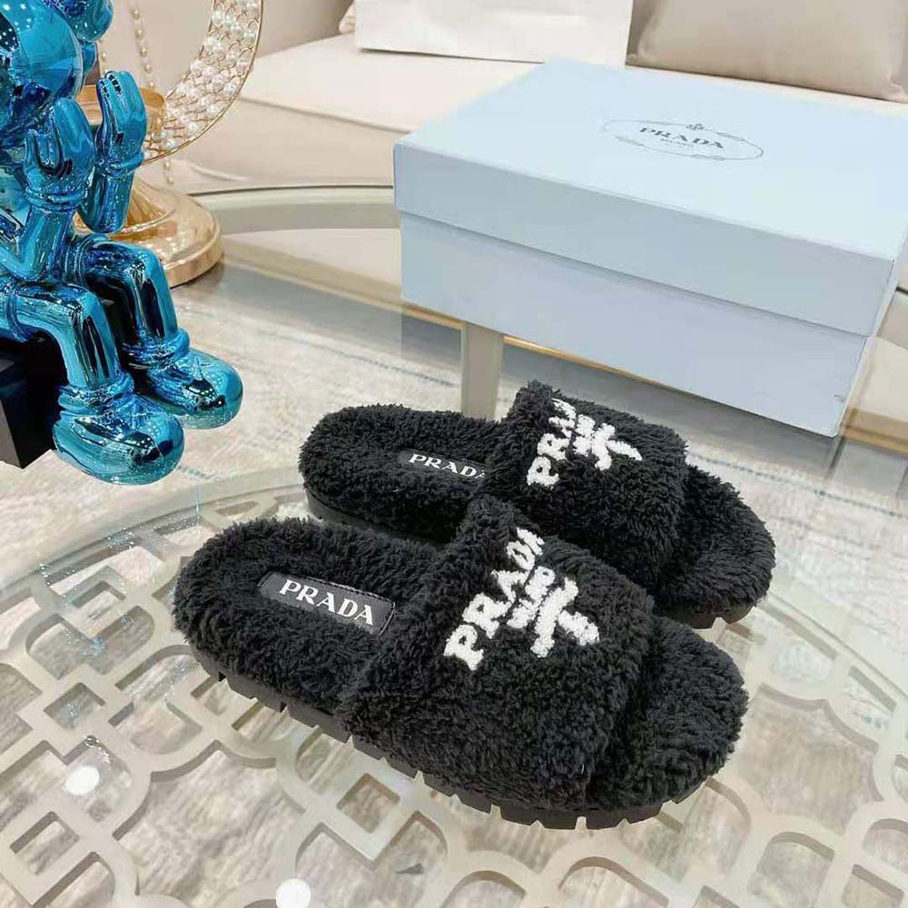 Close-up on black terry cloth texture of Prada Women Terry Cloth Slides