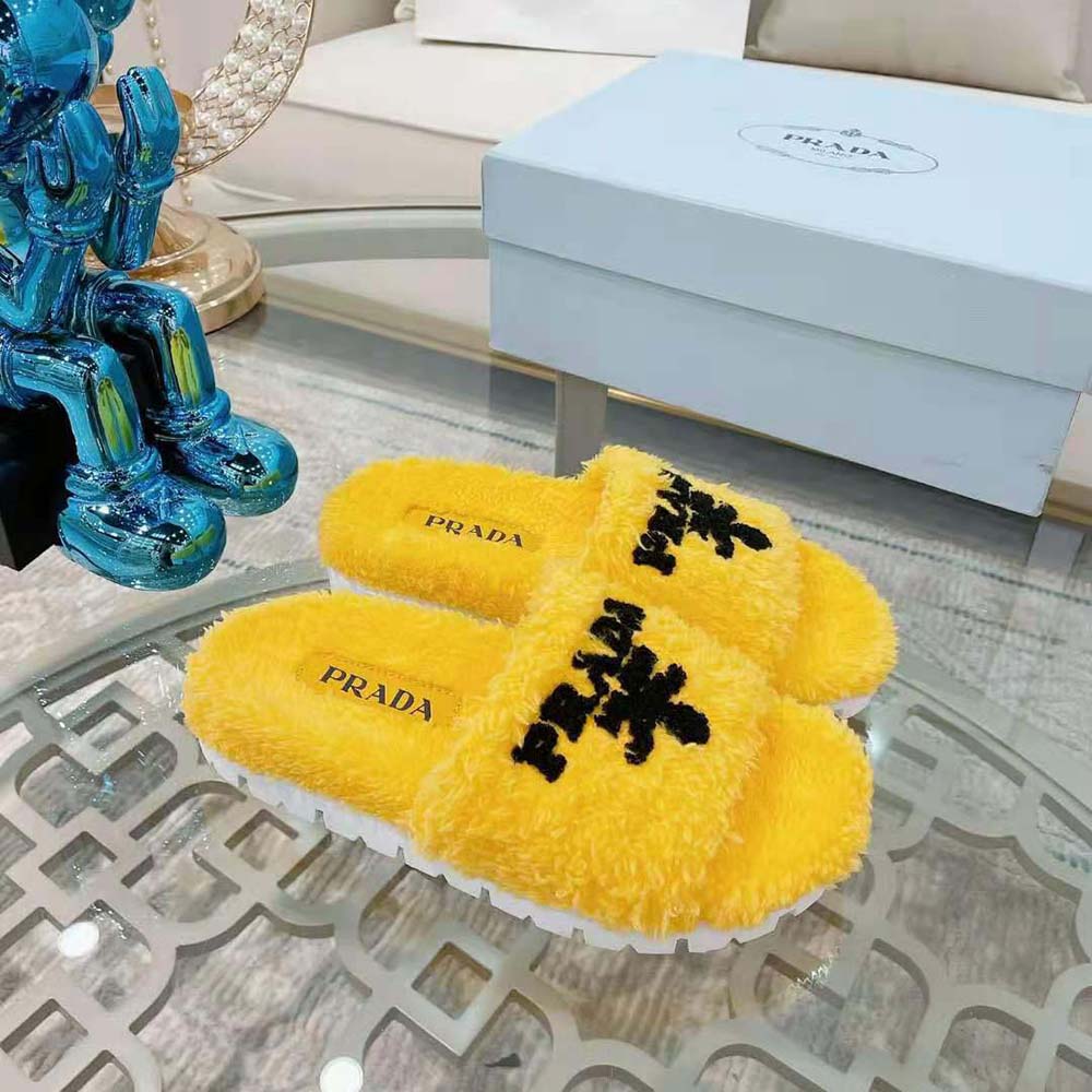 Close-up of yellow terry cloth and Prada logo hardware detail