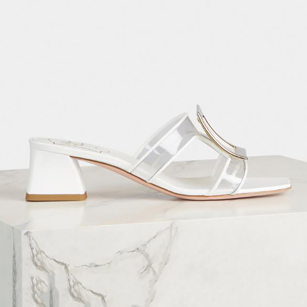 Side view of Roger Vivier Women Bikiviv Metal Buckle Mules in PVC-White
