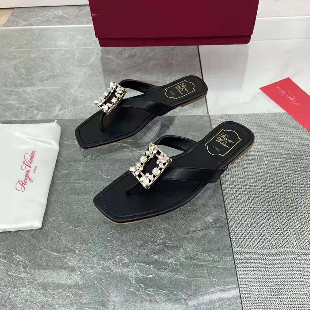 Top angle showing leather texture and thong silhouette of Roger Vivier mules