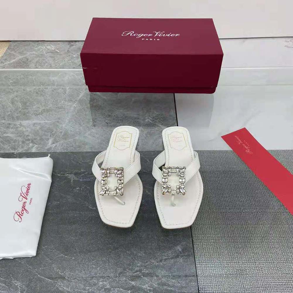 Close-up of signature buckle on Roger Vivier Women Mini Broche Vivier Buckle Thong Mules