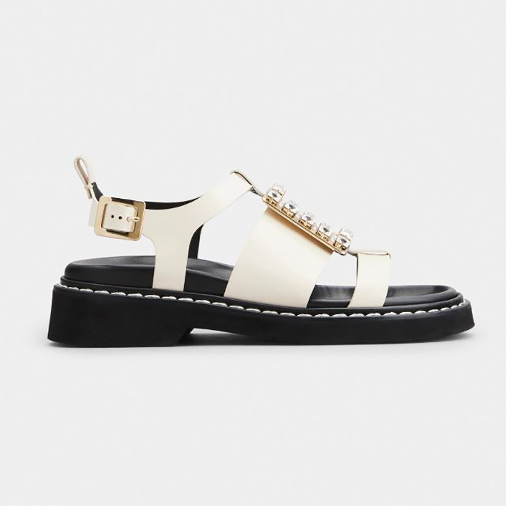Side view of Roger Vivier Women Viv’ Rangers Strass Buckle Sandals in White Leather