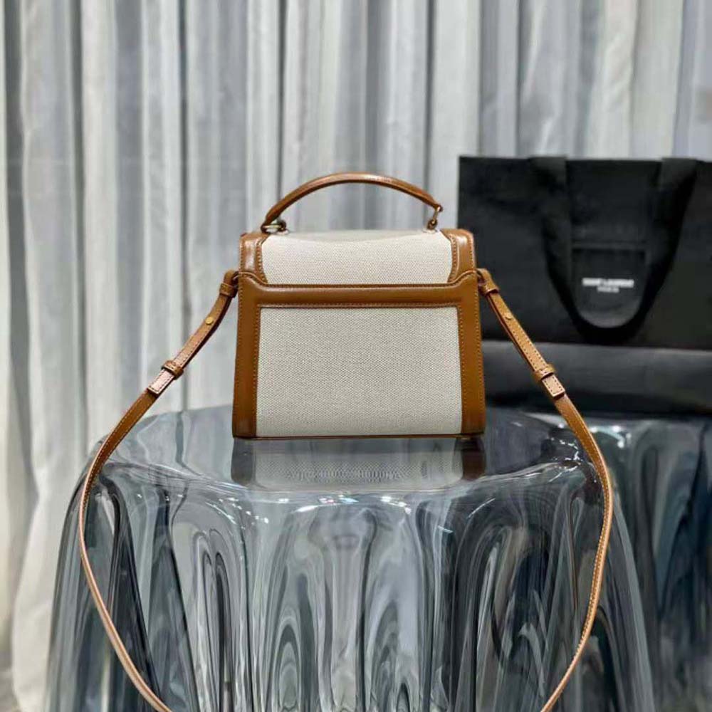 Side angle showing smooth leather top handle on Saint Laurent YSL Women Cassandra Mini Top Handle Bag