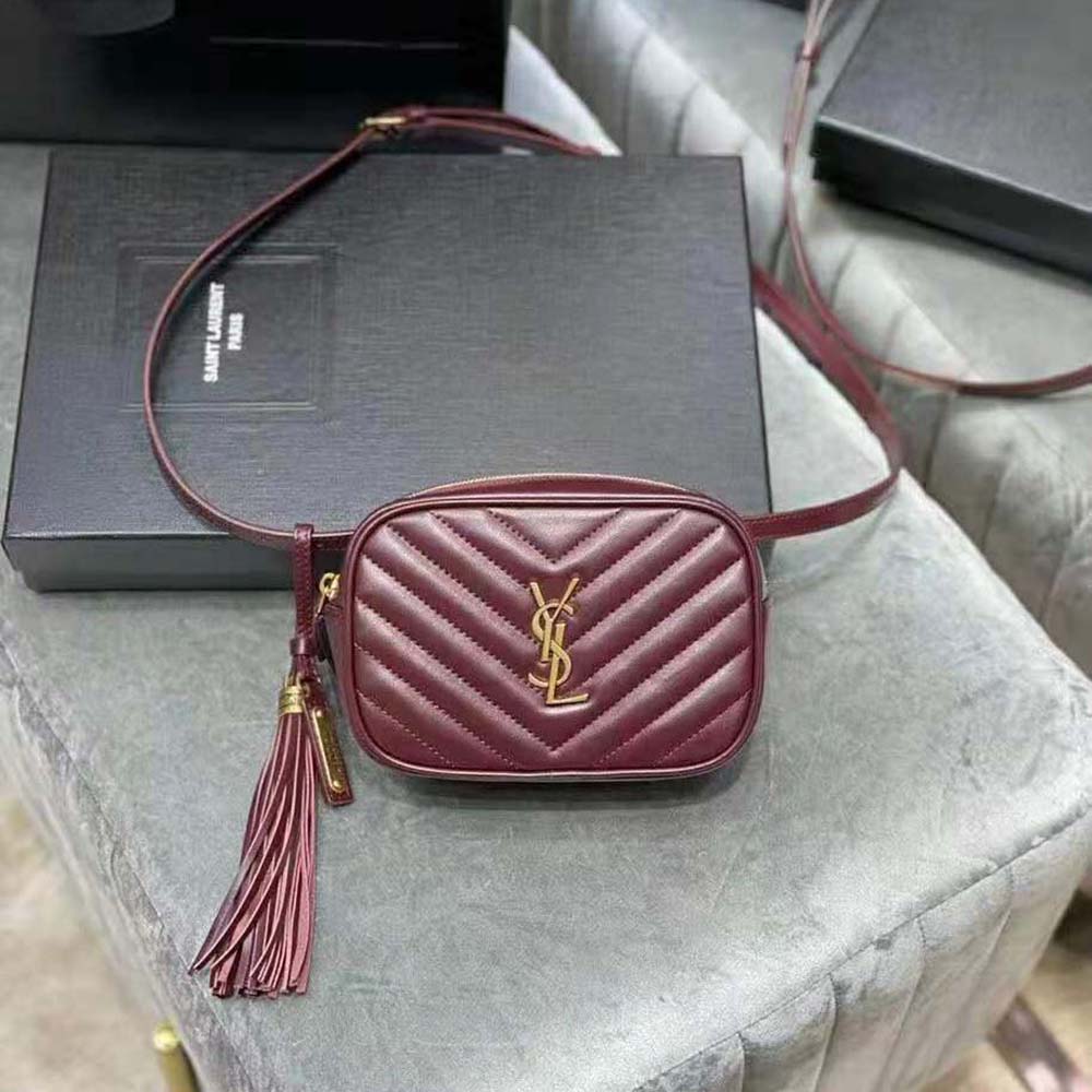 Close-up of gold YSL monogram on Lou Belt Bag maroon leather