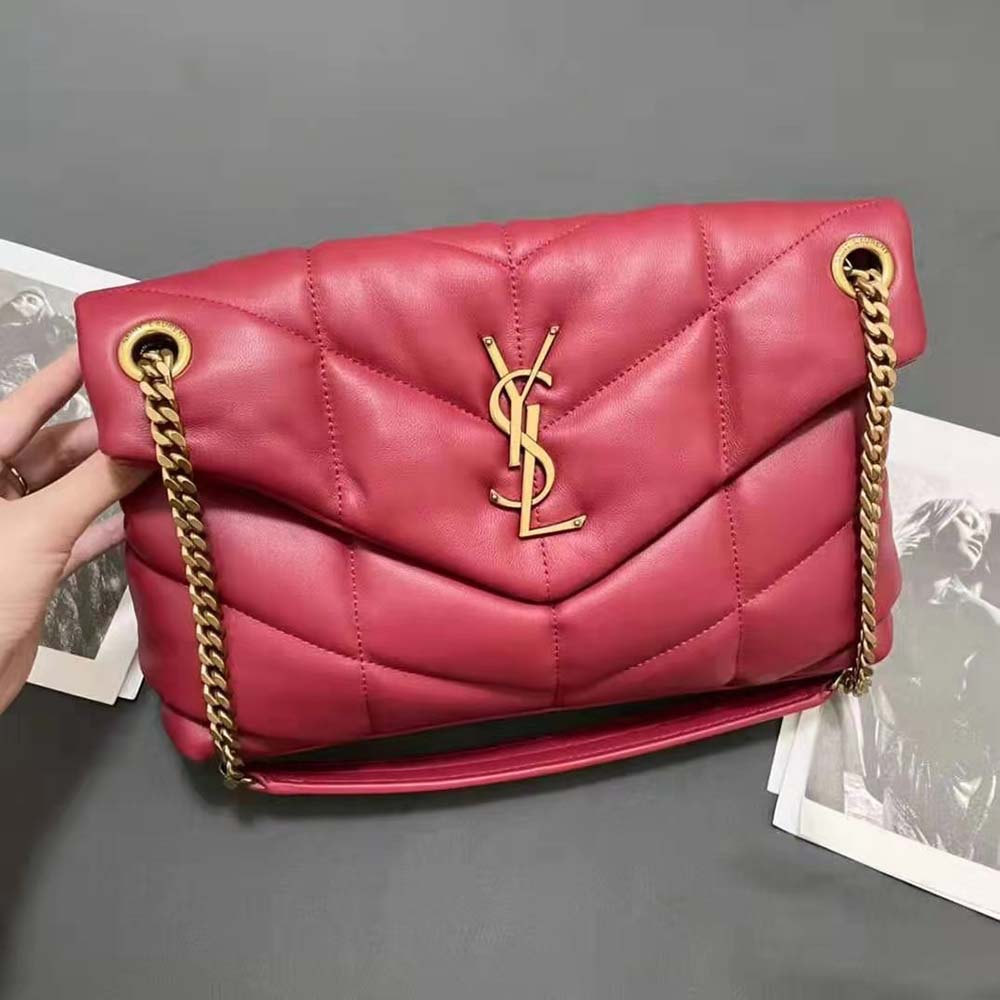 Close-up of gold YSL hardware on Saint Laurent puffer small bag in red