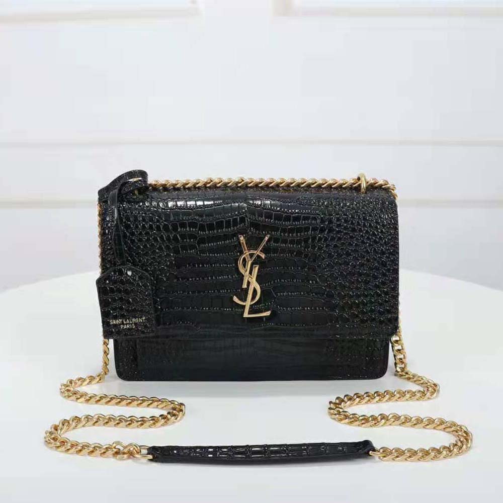 Close-up of gold YSL logo hardware on Crocodile-Embossed Shiny Leather Sunset bag