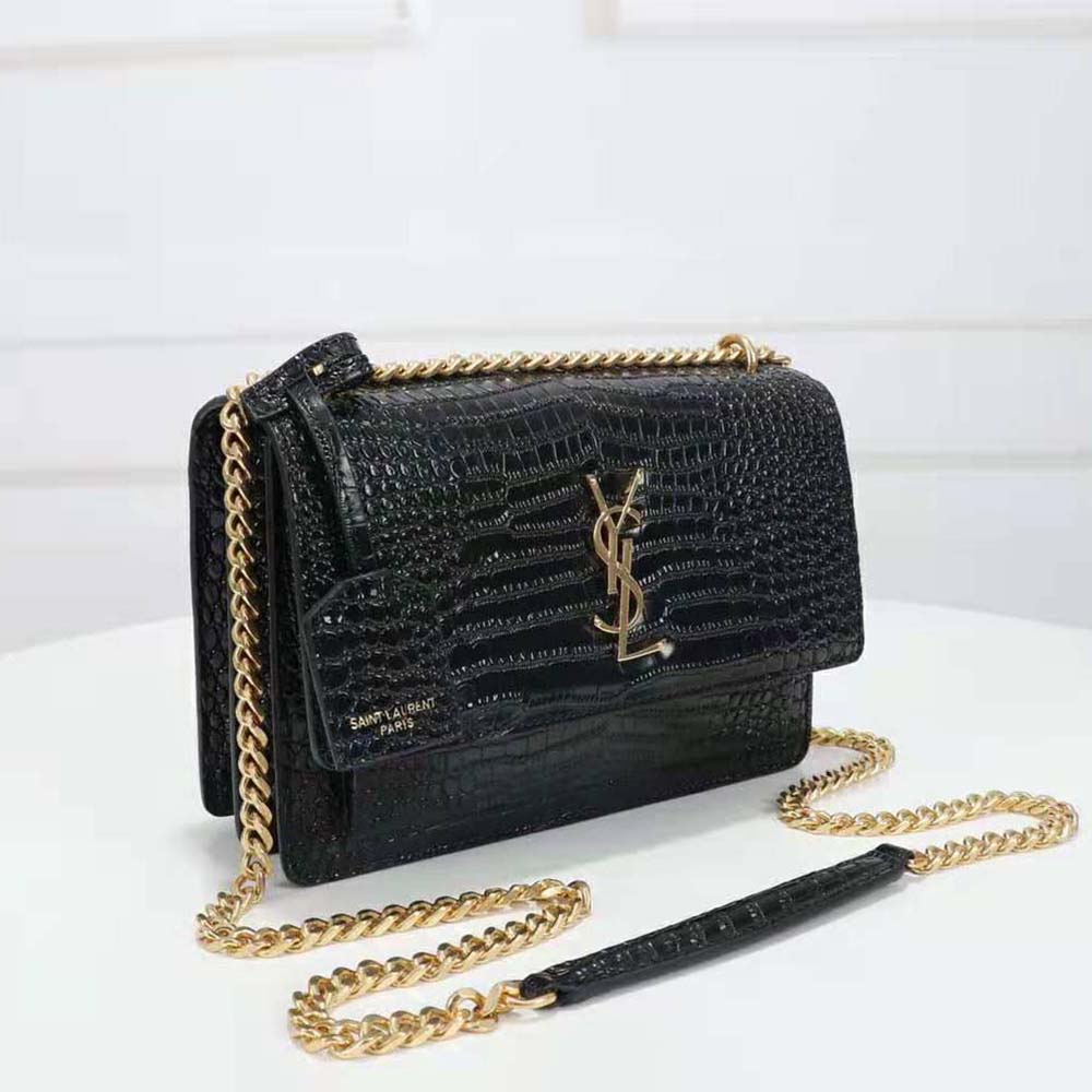 Side angle showing magnetic flap closure of Saint Laurent YSL Women Sunset Medium bag