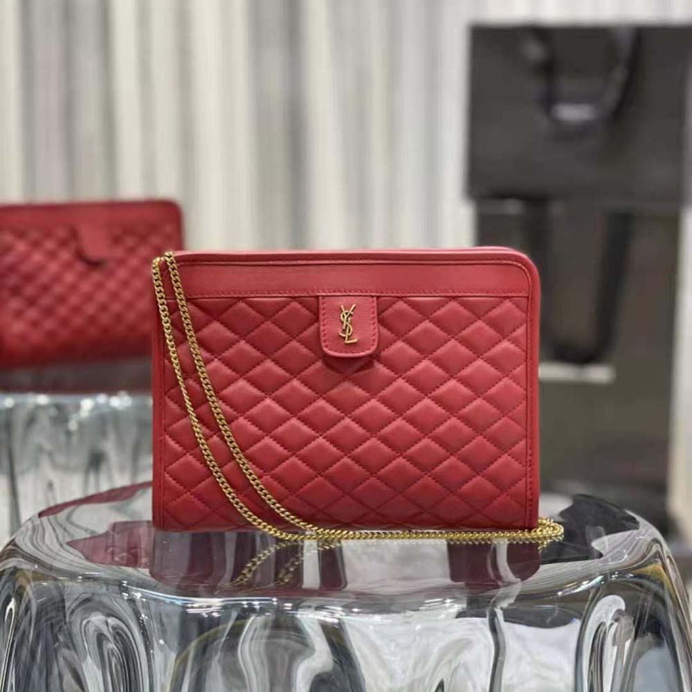 Close-up of gold YSL logo clasp on red leather Victoire Baby Clutch