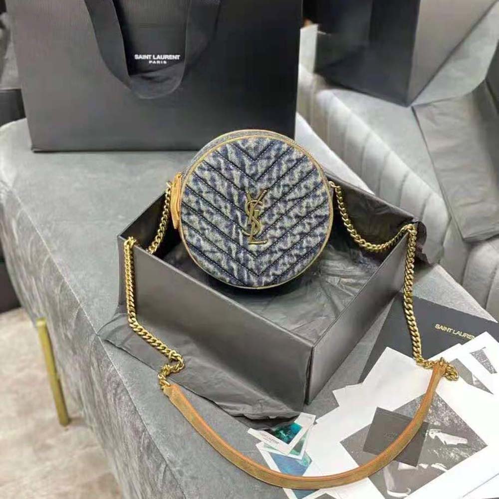 Close-up of chevron quilting and gold YSL hardware detail on bag