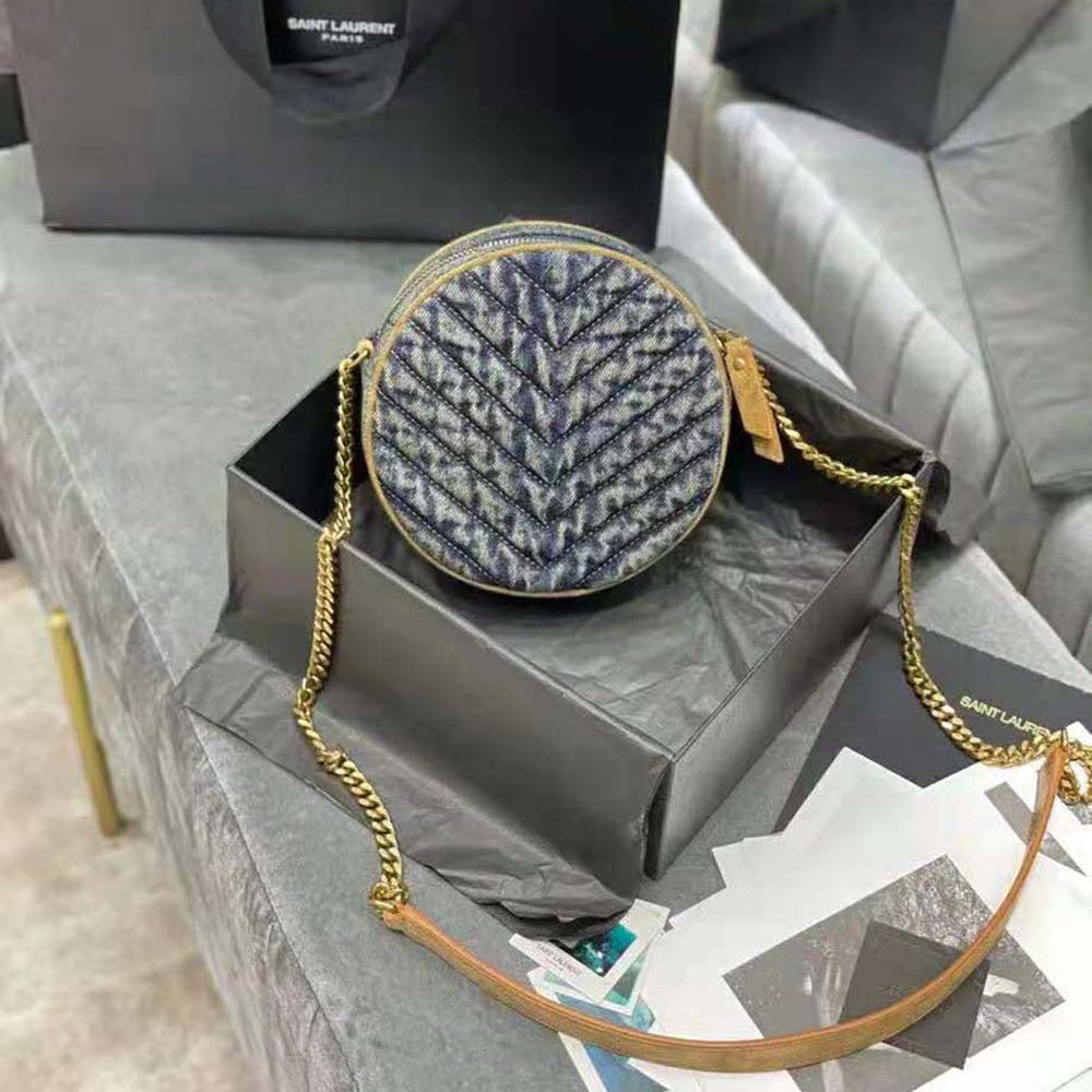 Side angle showing suede trim and adjustable strap of Saint Laurent bag