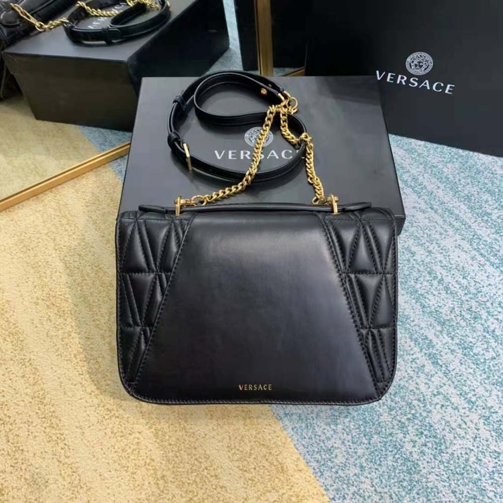 Side angle showing structured silhouette of Versace Women Virtus Quilted Shoulder Bag-Black