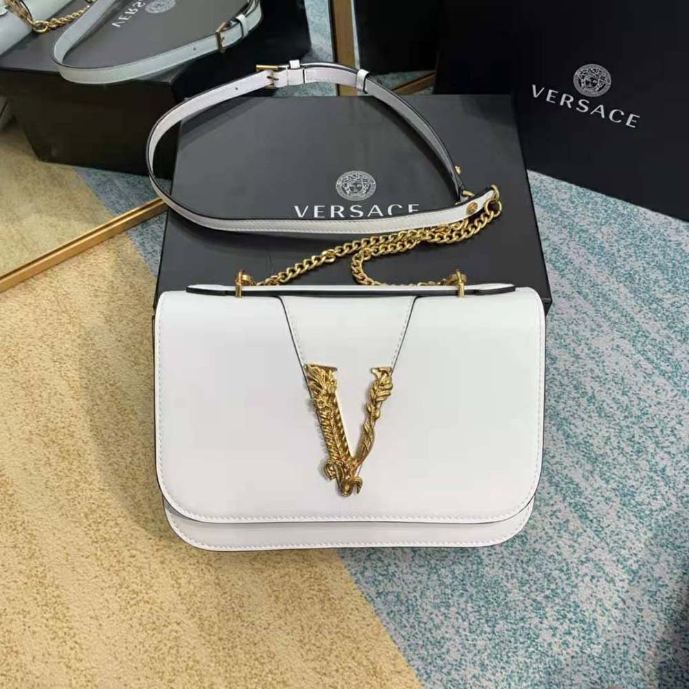Close-up of gold Medusa hardware on Versace Women Virtus Shoulder Bag-White
