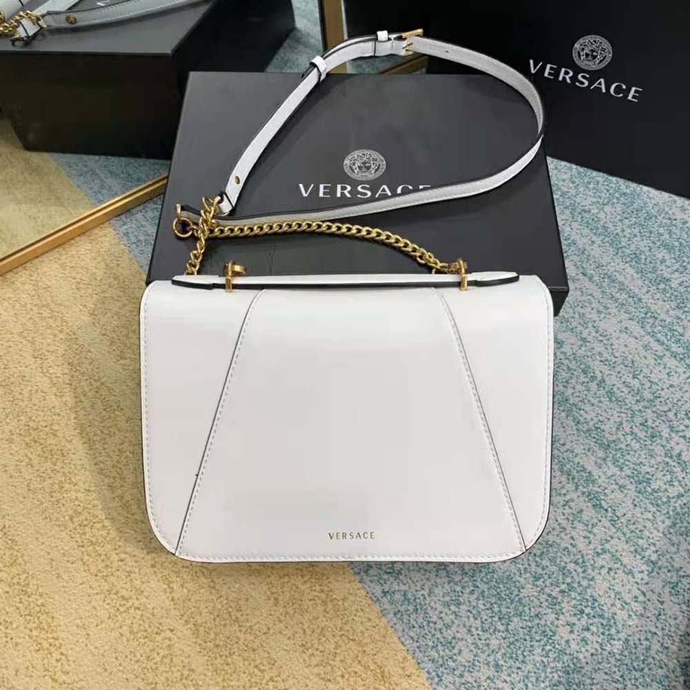 Side angle showing smooth leather and strap on Versace Women Virtus Shoulder Bag-White