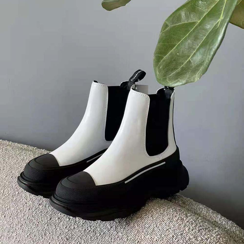 Front view of Alexander Mcqueen Women Tread Slick Boot-Black with signature chunky sole