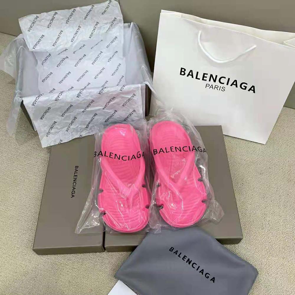 Close-up of pink molded rubber and embossed Balenciaga logo on sandal