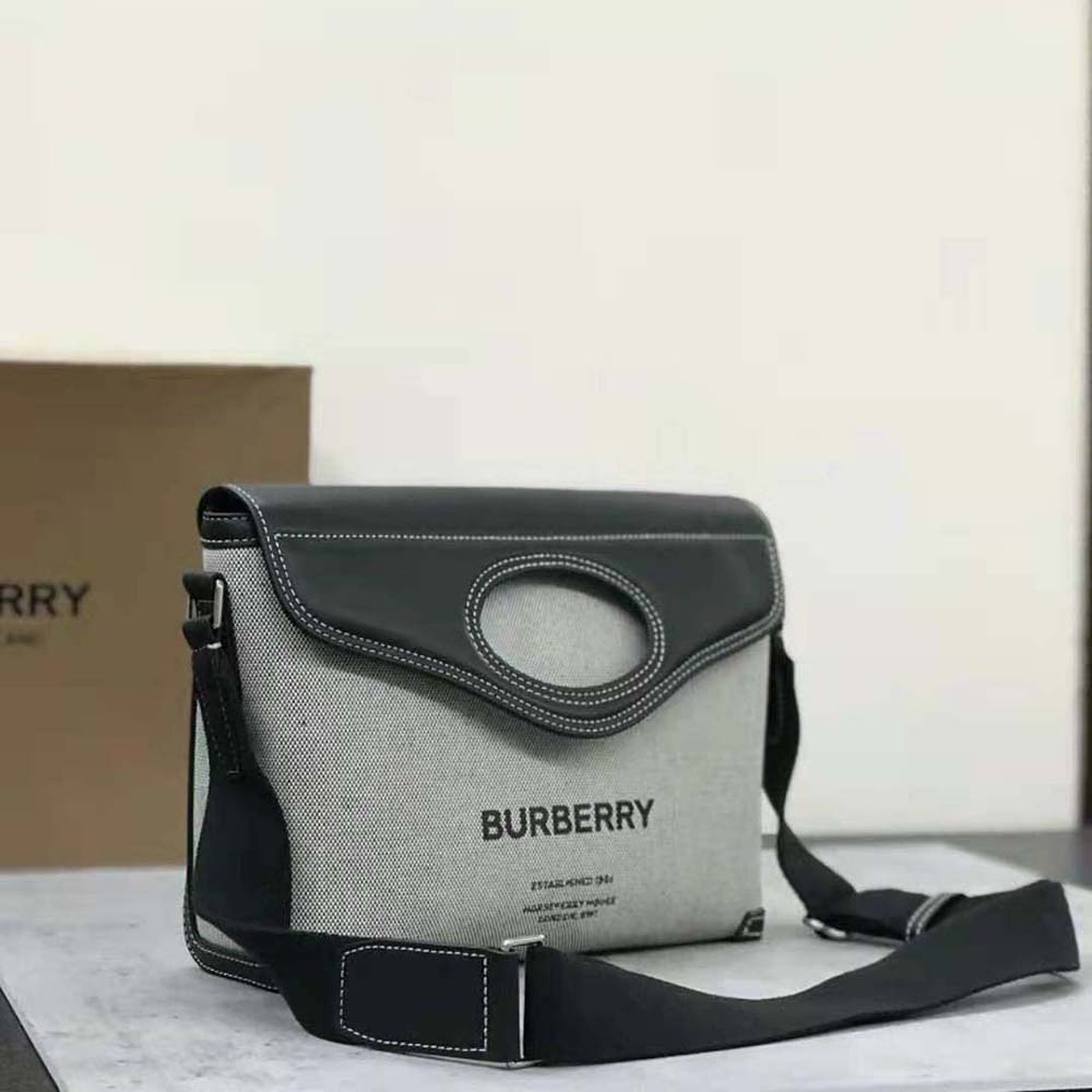 Side view showing zip closure and silver hardware on Burberry messenger bag