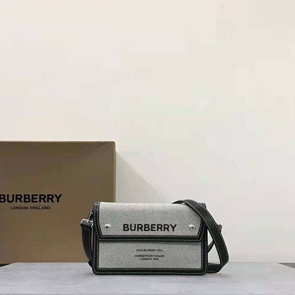 Close-up of Burberry crossbody bag’s Horseferry check canvas and leather trim detail