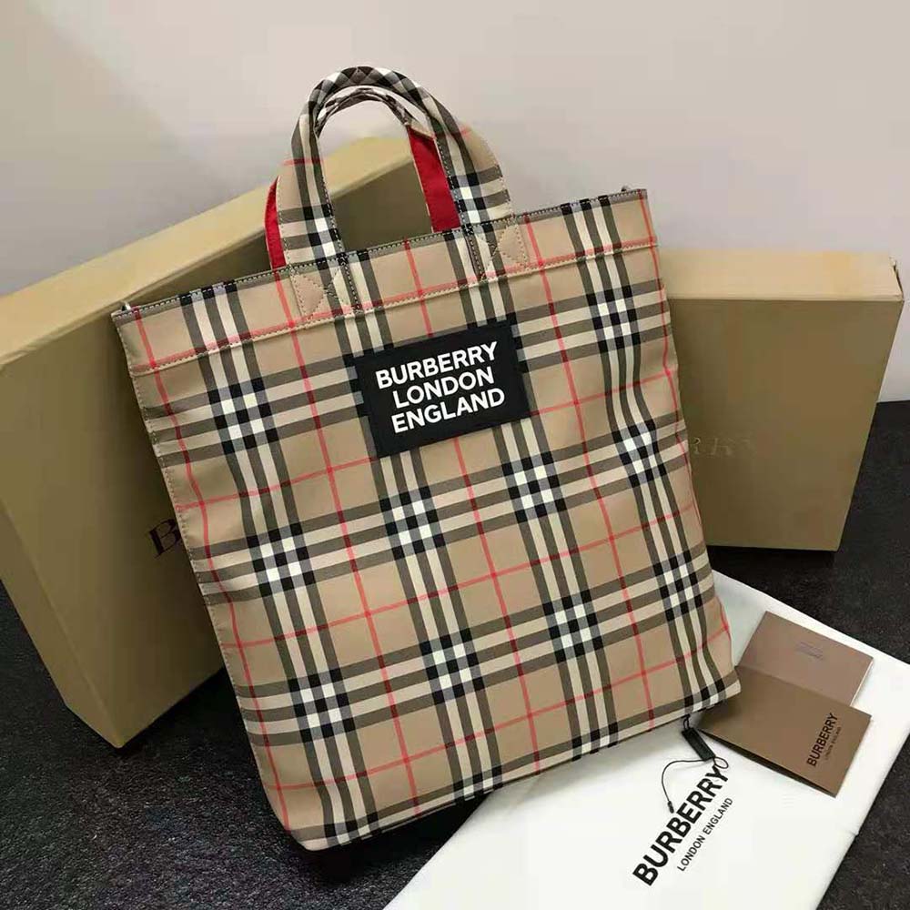 Close-up detail of logo applique on Burberry vintage check tote