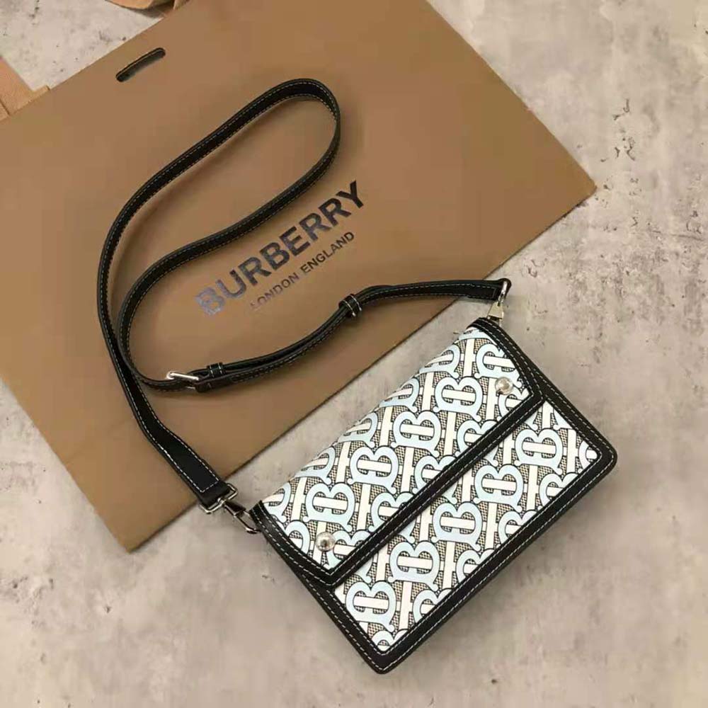 Side angle showing adjustable strap on Burberry Men Monogram crossbody bag