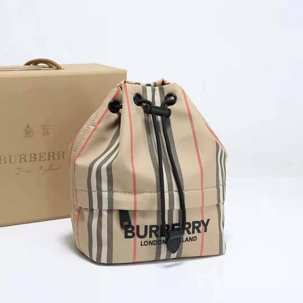 Close-up detail of Burberry signature stripe on ECONYL drawcord pouch