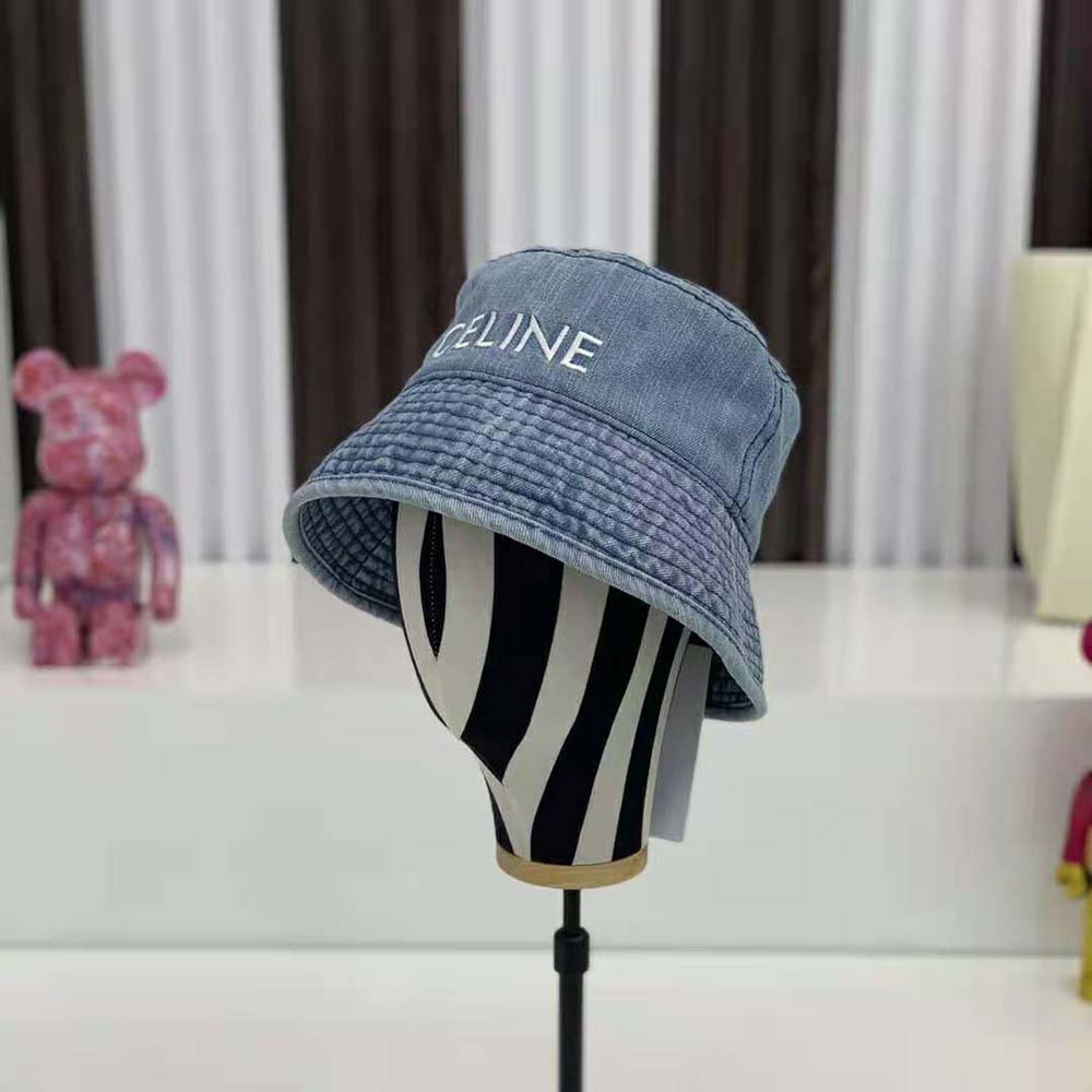 Close-up detail of denim fabric and embossed Celine logo on bucket hat