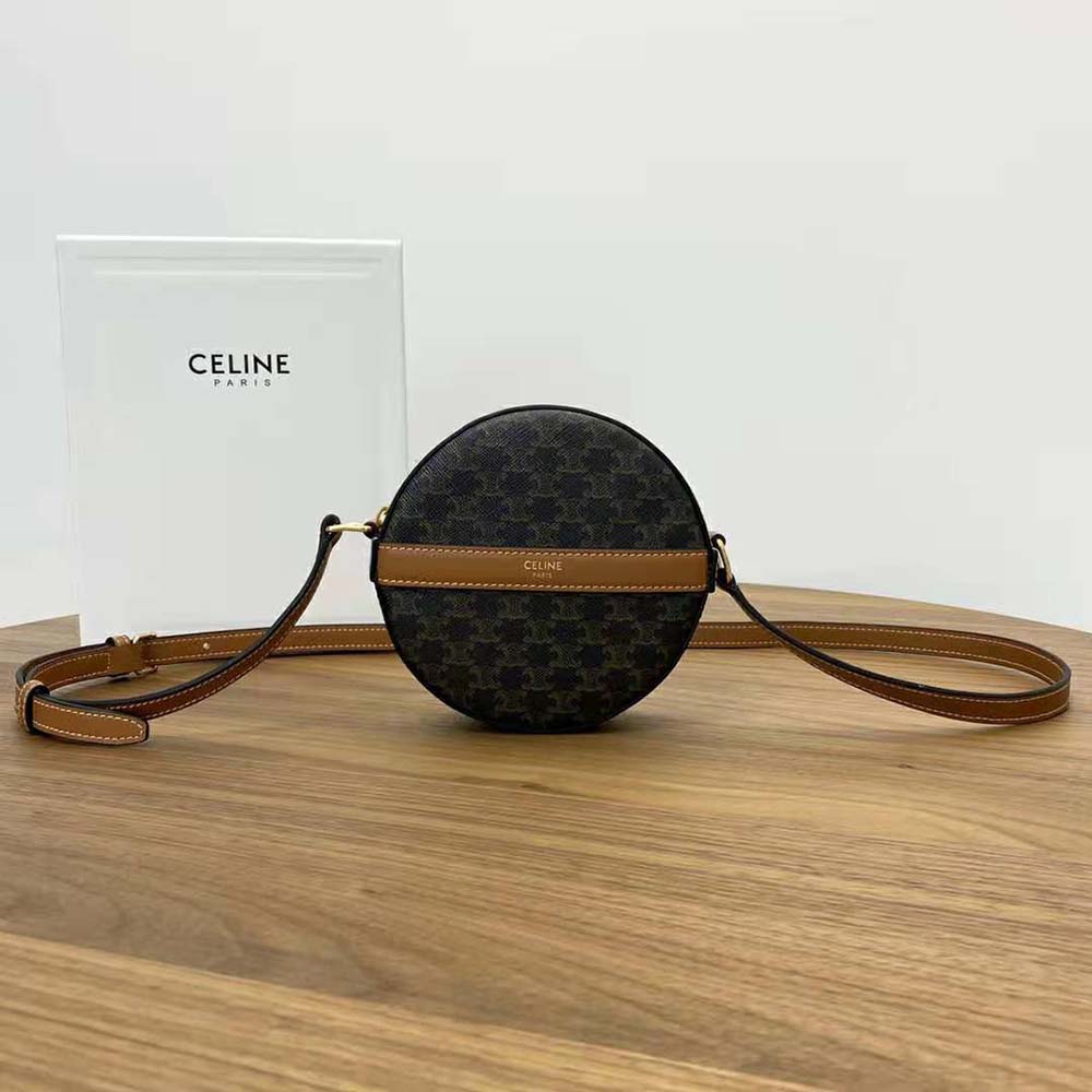 Close-up of gold-tone Triomphe clasp on Celine Women Round Purse on Strap