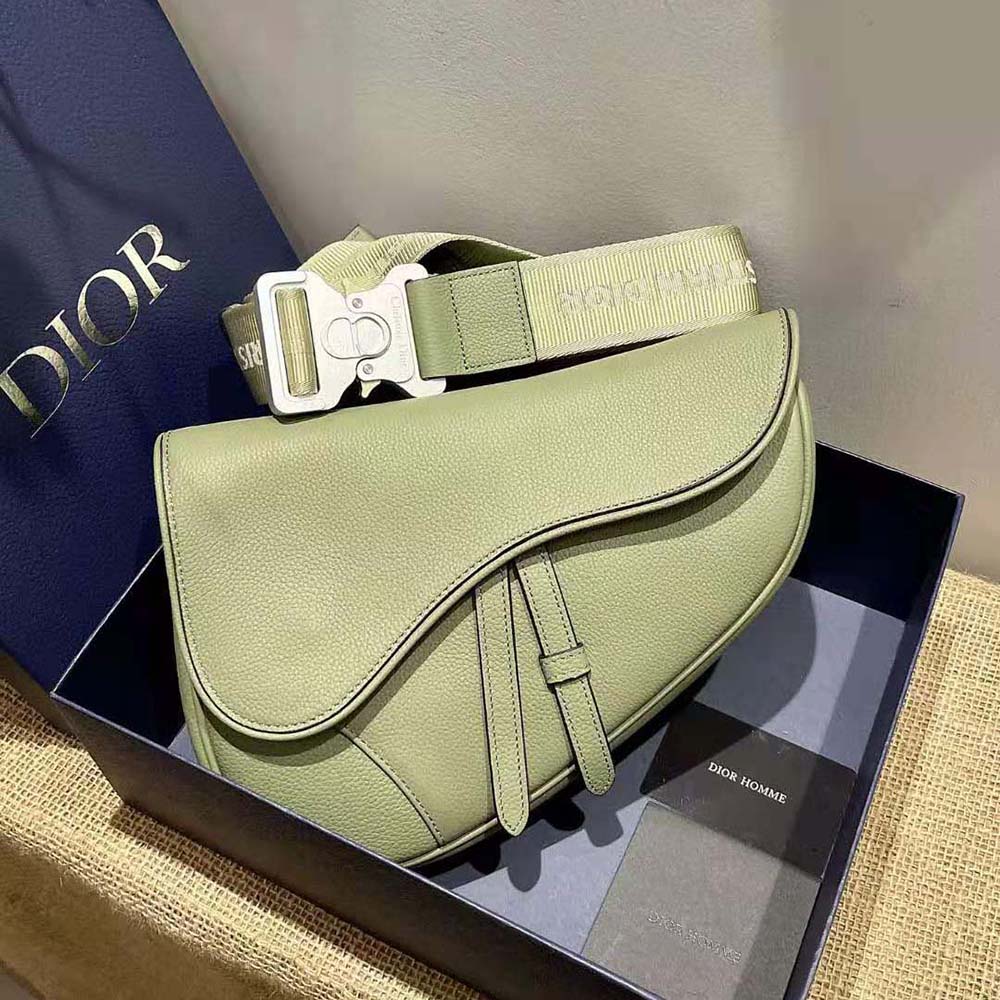 Side angle of Dior Men Saddle Bag Khaki Grained Calfskin with shoulder strap