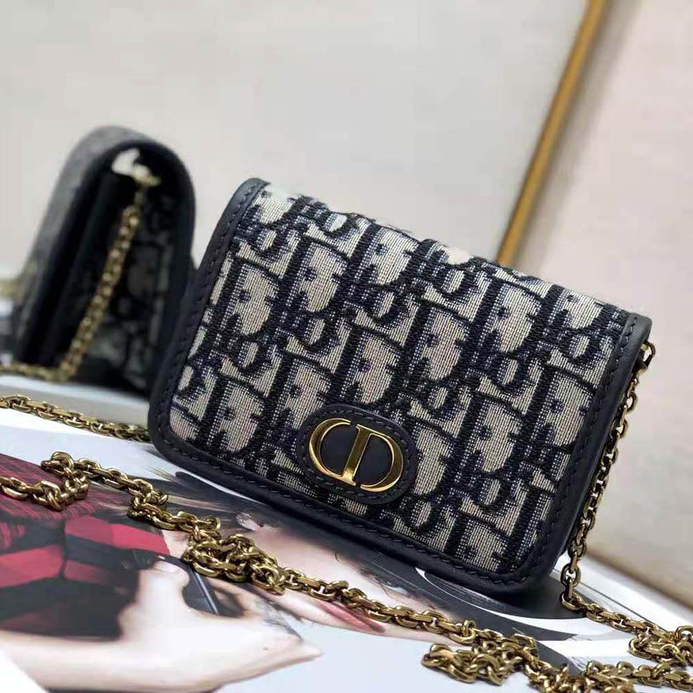 Close-up of blue jacquard fabric and silver-tone hardware on Dior Women 30 Montaigne nano pouch