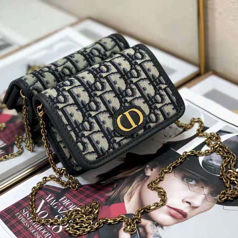 Side profile showcasing slim silhouette of Dior Women 30 Montaigne nano pouch Blue Dior Oblique Jacquard