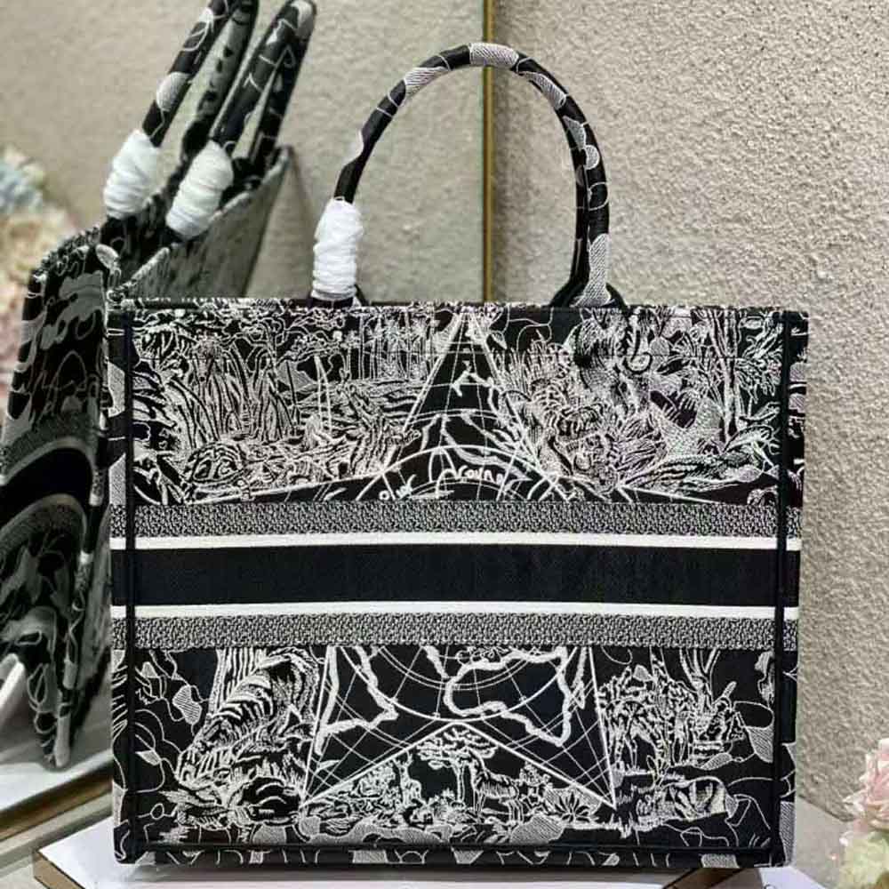 Side angle showing silver hardware on Dior Women Book Tote embroidery