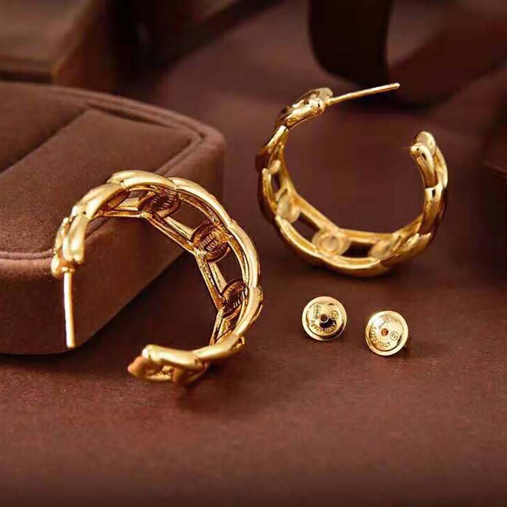 Side profile showcasing the gold-finish and navy detail earrings