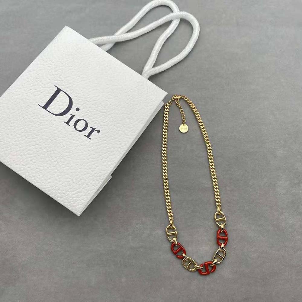 Close-up detail of raspberry lacquer on Dior Women CD Navy Necklace