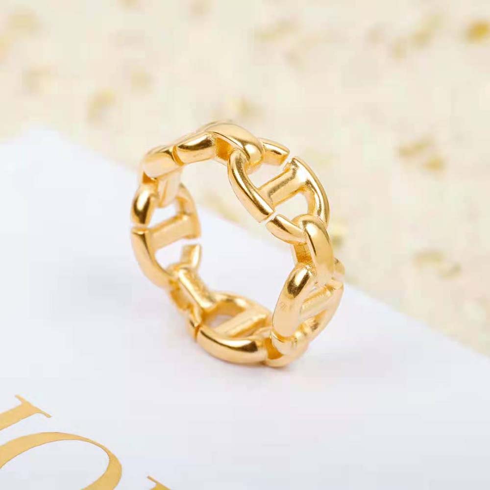 Dior Women CD Navy Ring Gold-Finish Metal worn on hand in natural light